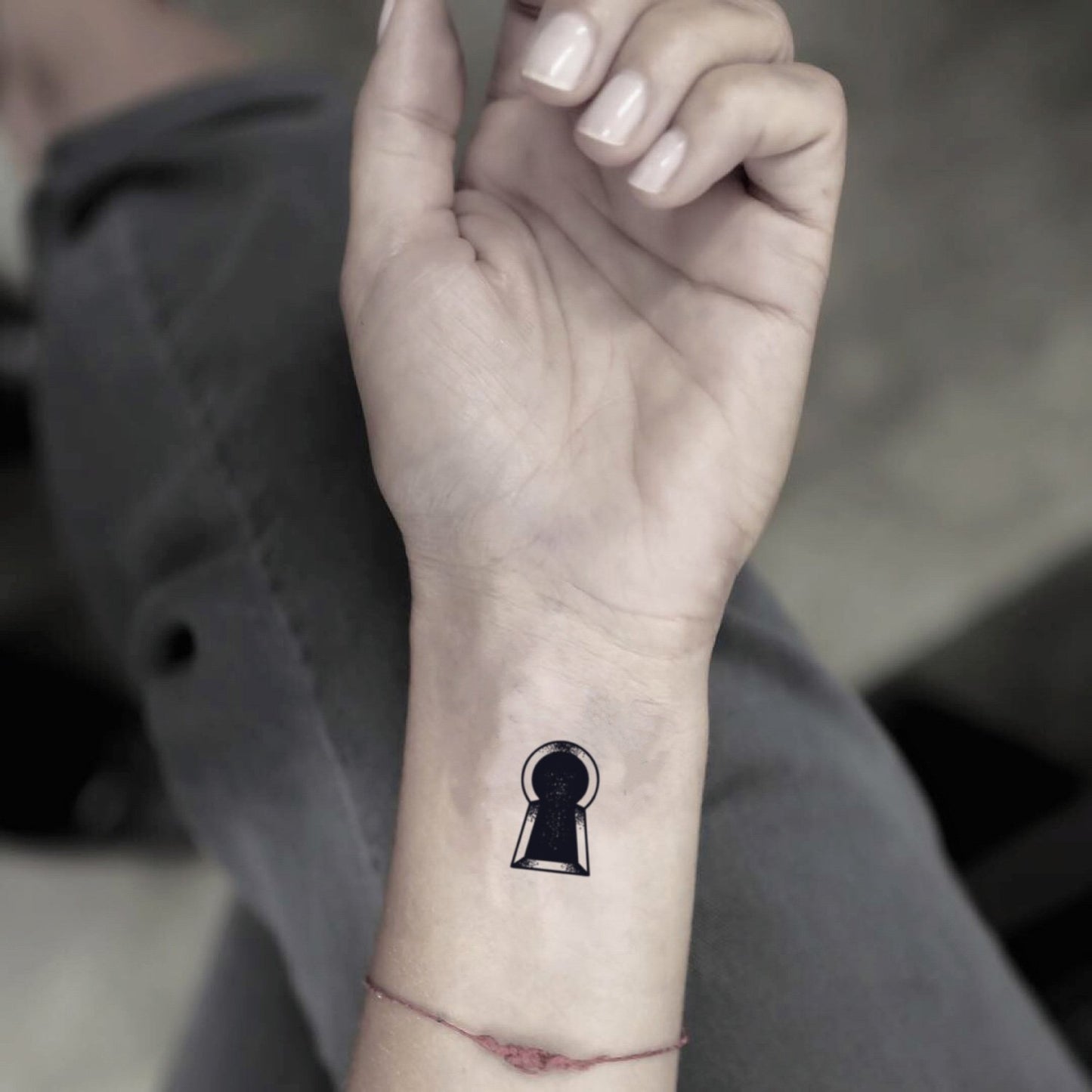 fake small keyhole minimalist temporary tattoo sticker design idea on wrist