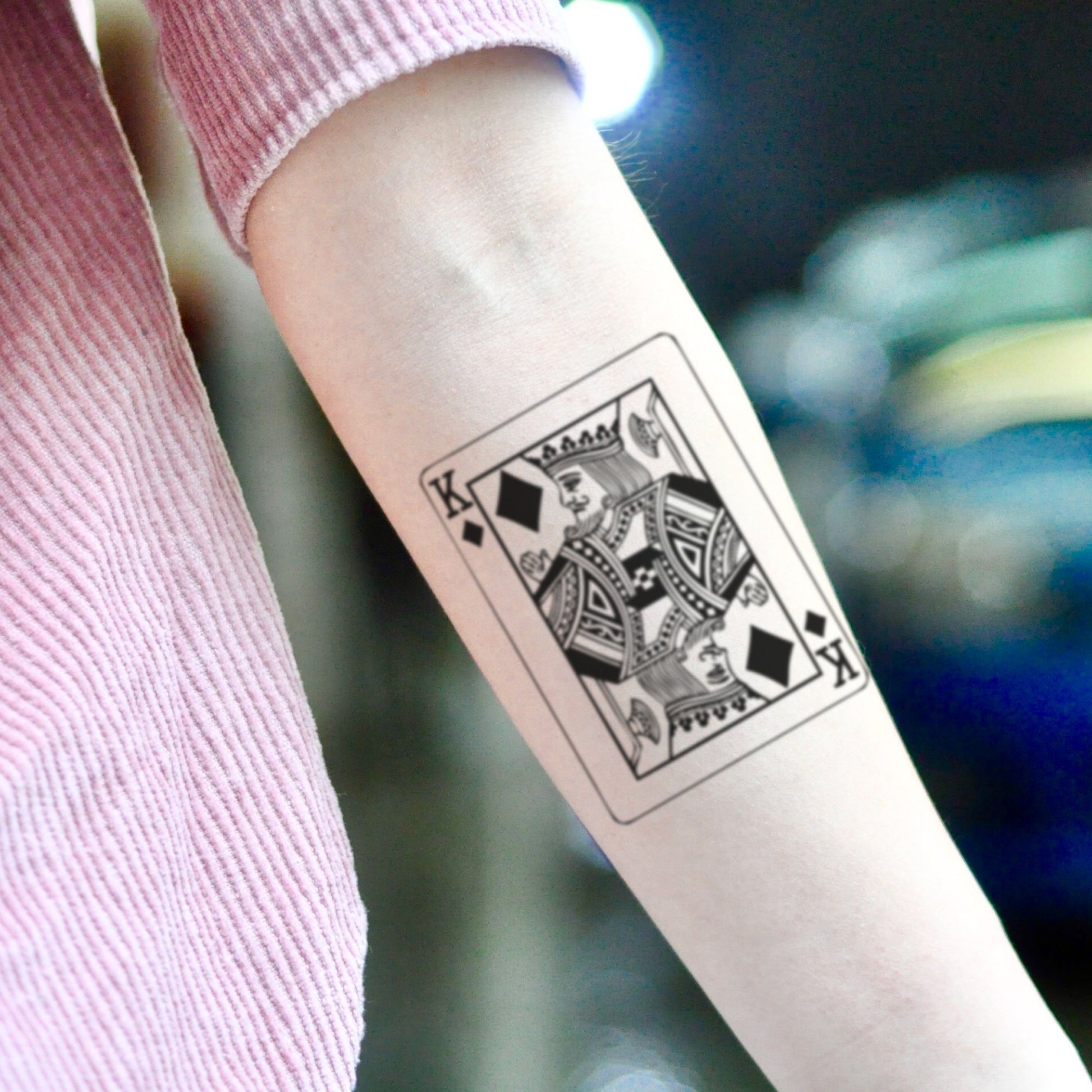 fake small king of diamonds playing card illustrative temporary tattoo sticker design idea on inner arm