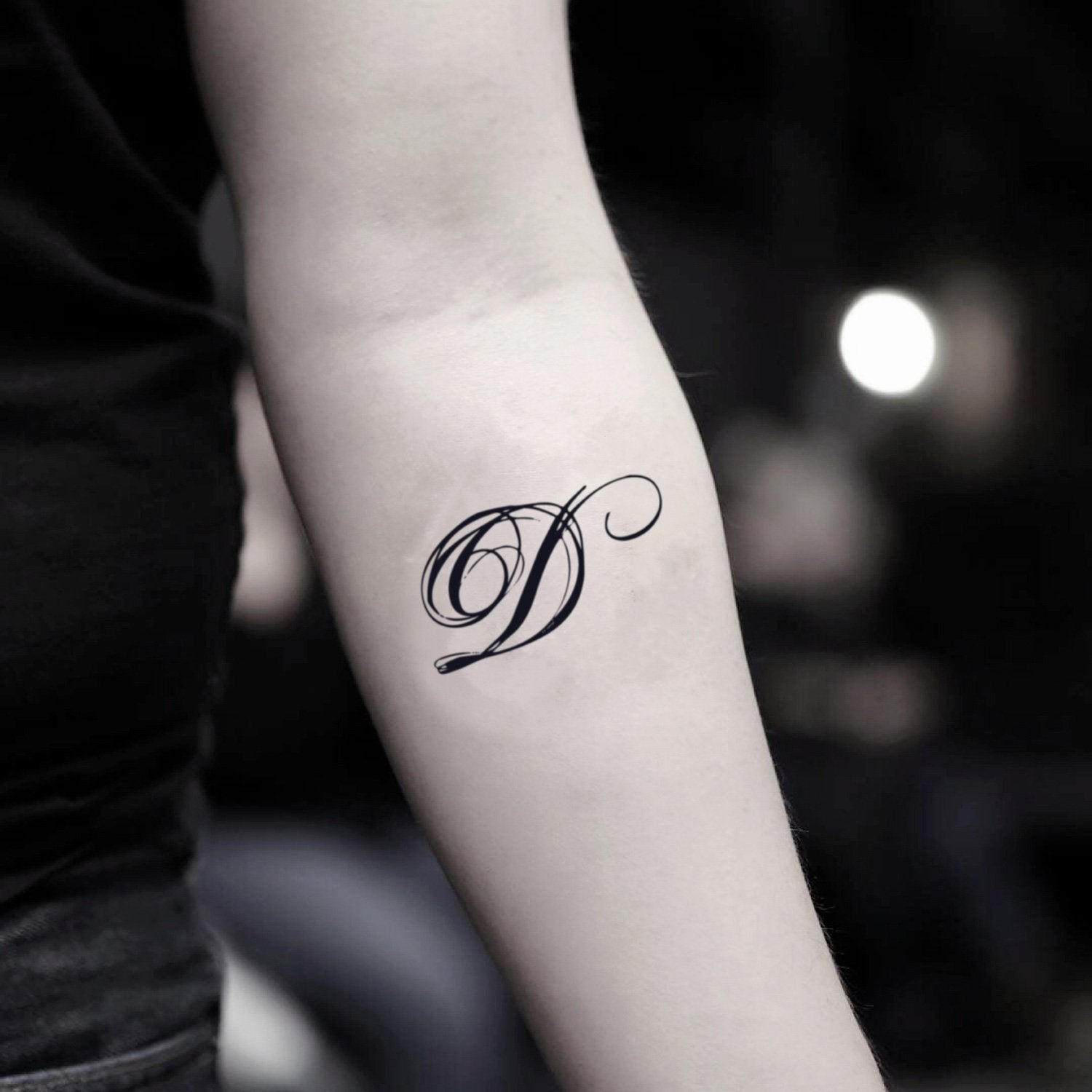 fake small initial letter d lettering temporary tattoo sticker design idea on inner arm