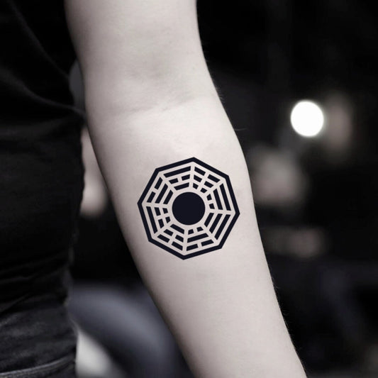 fake small lost dharma wheel dharmachakra geometric temporary tattoo sticker design idea on inner arm