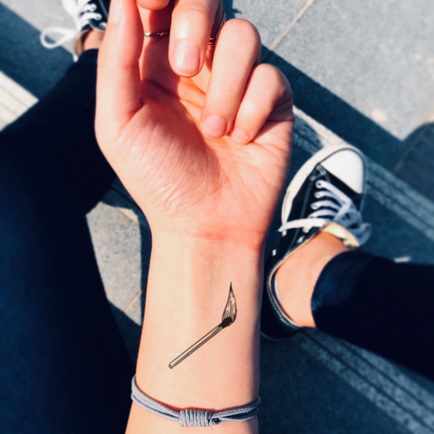 fake small matchstick minimalist temporary tattoo sticker design idea on wrist