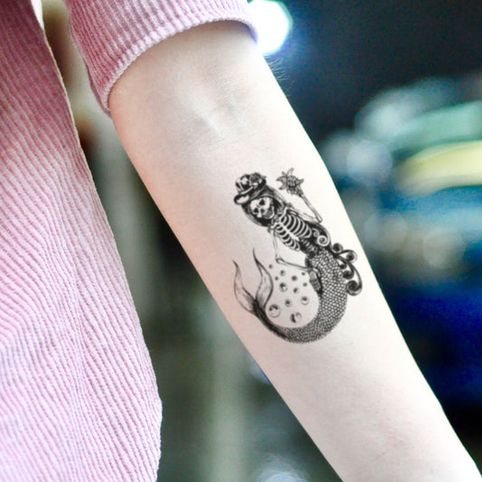 fake small mermaid skeleton siren illustrative temporary tattoo sticker design idea on inner arm
