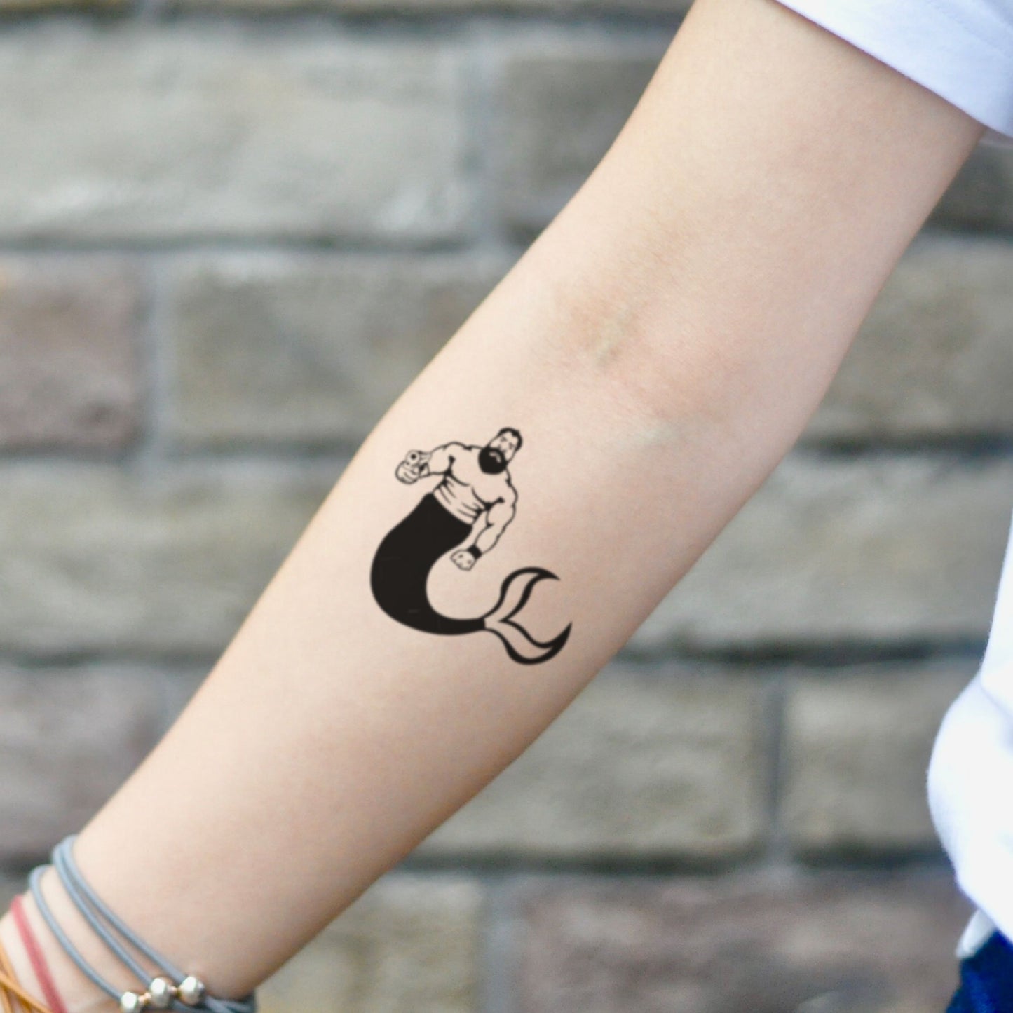 fake small merman illustrative temporary tattoo sticker design idea on inner arm