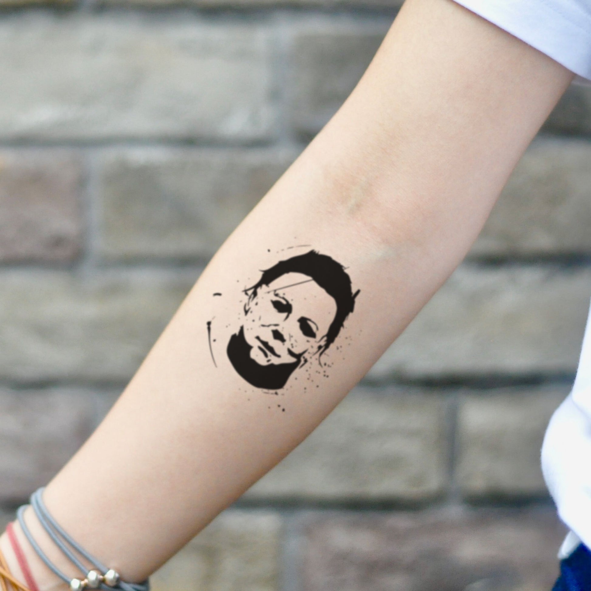 fake small michael myers portrait temporary tattoo sticker design idea on inner arm