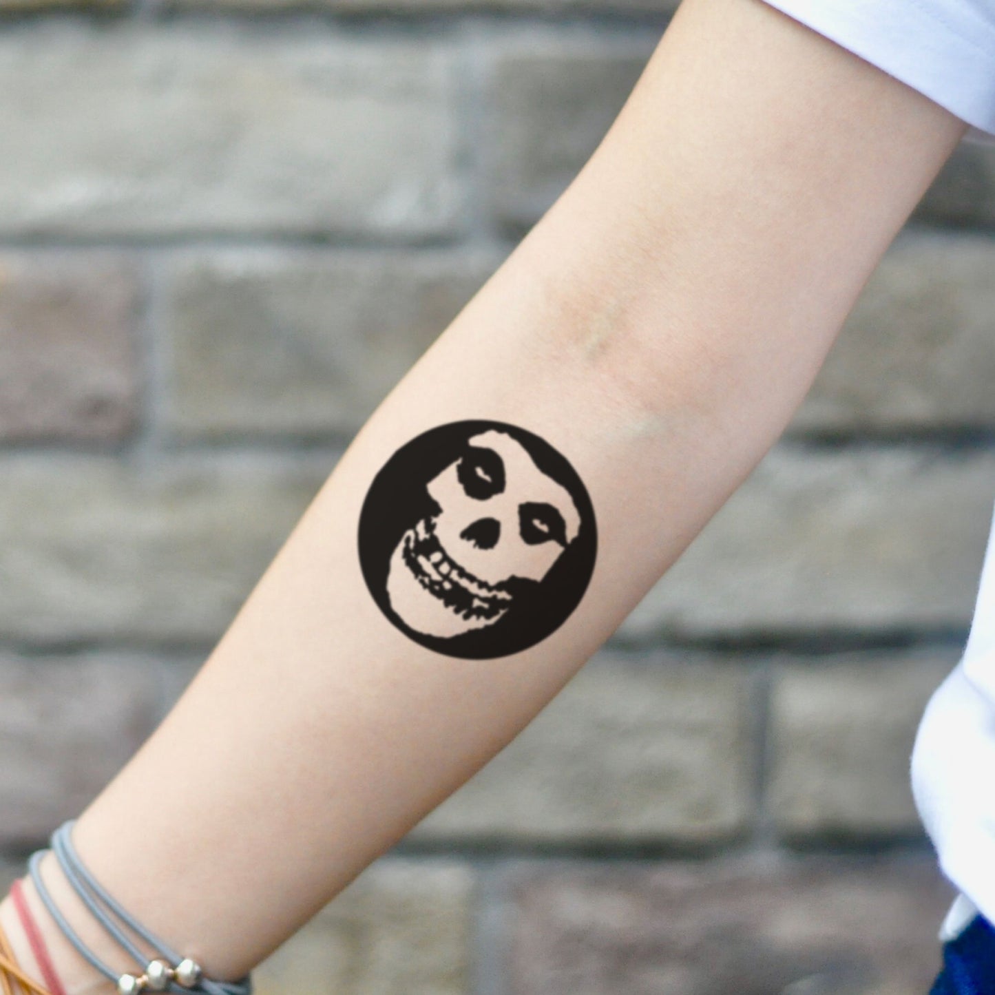 fake small misfits crimson ghost skull minimalist temporary tattoo sticker design idea on inner arm