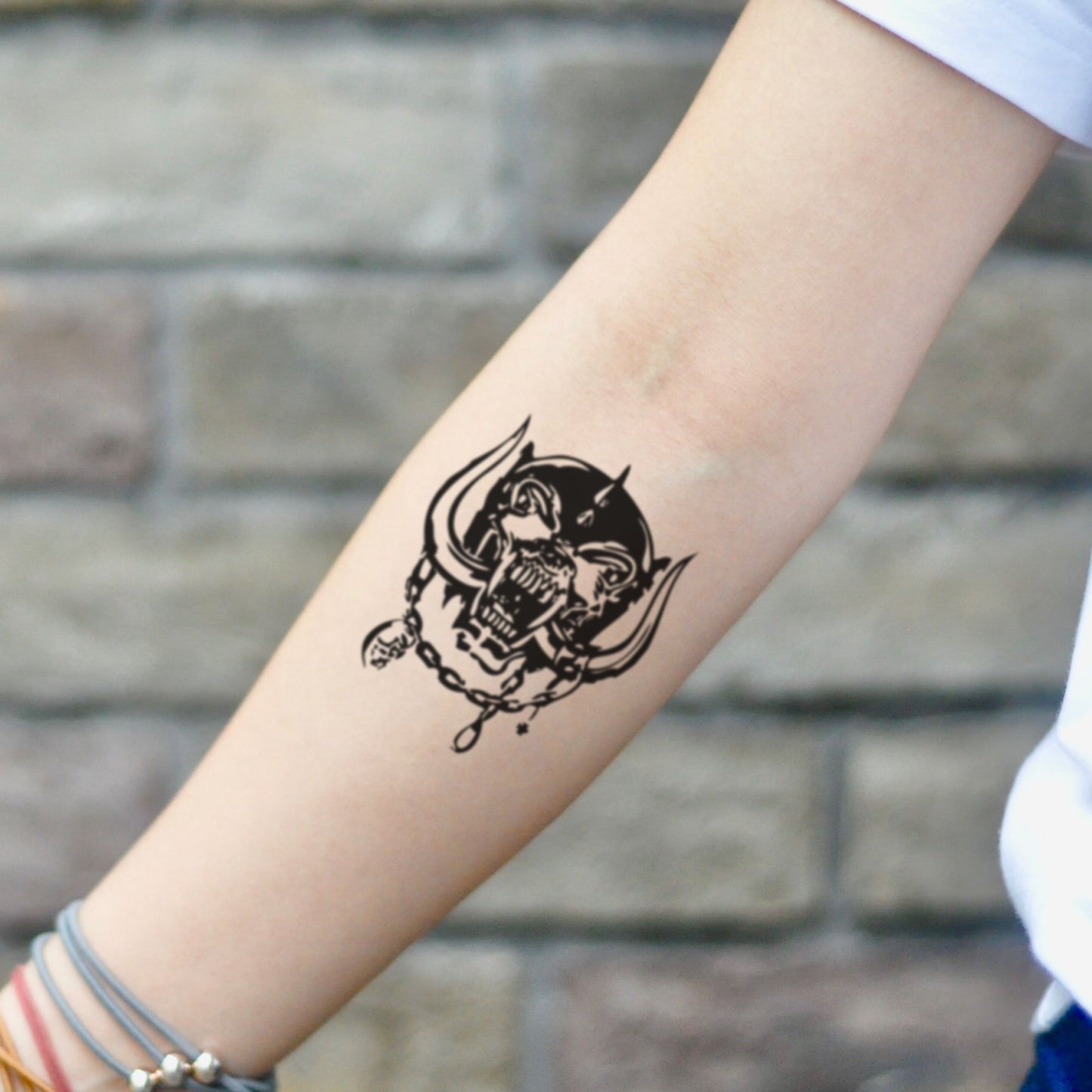 fake small motorhead illustrative temporary tattoo sticker design idea on inner arm