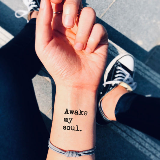 fake small mumford and sons - awake my soul lettering temporary tattoo sticker design idea on wrist