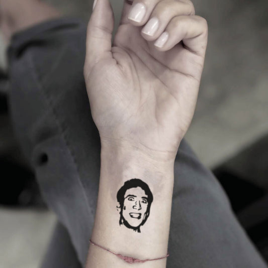 fake small nicolas cage portrait temporary tattoo sticker design idea on wrist
