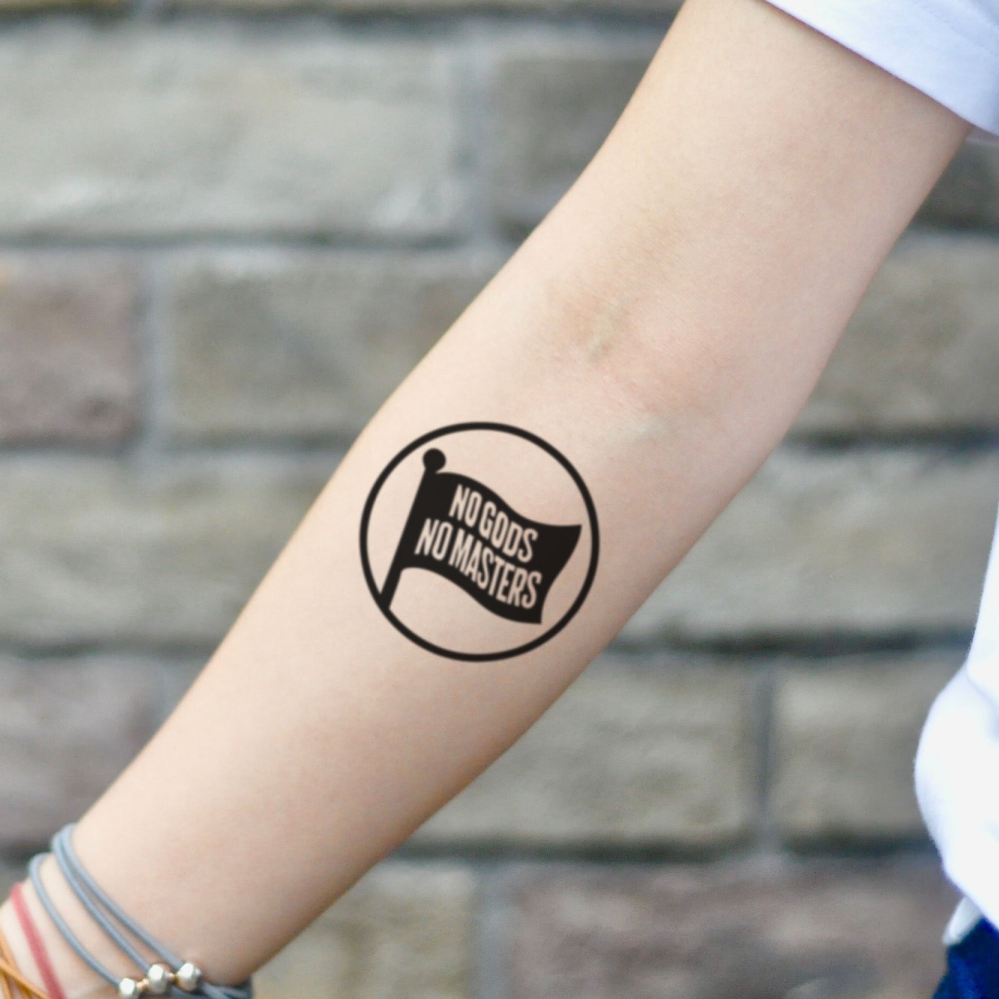 fake small no gods no masters lettering temporary tattoo sticker design idea on inner arm