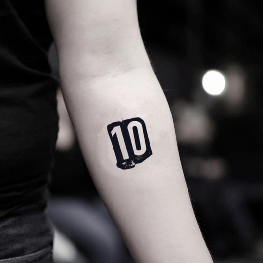 fake small number 10 numeral lettering temporary tattoo sticker design idea on inner arm