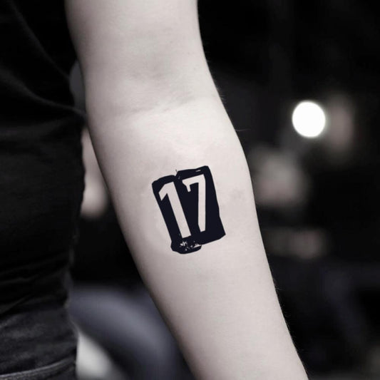 fake small number 17 numeral lettering temporary tattoo sticker design idea on inner arm