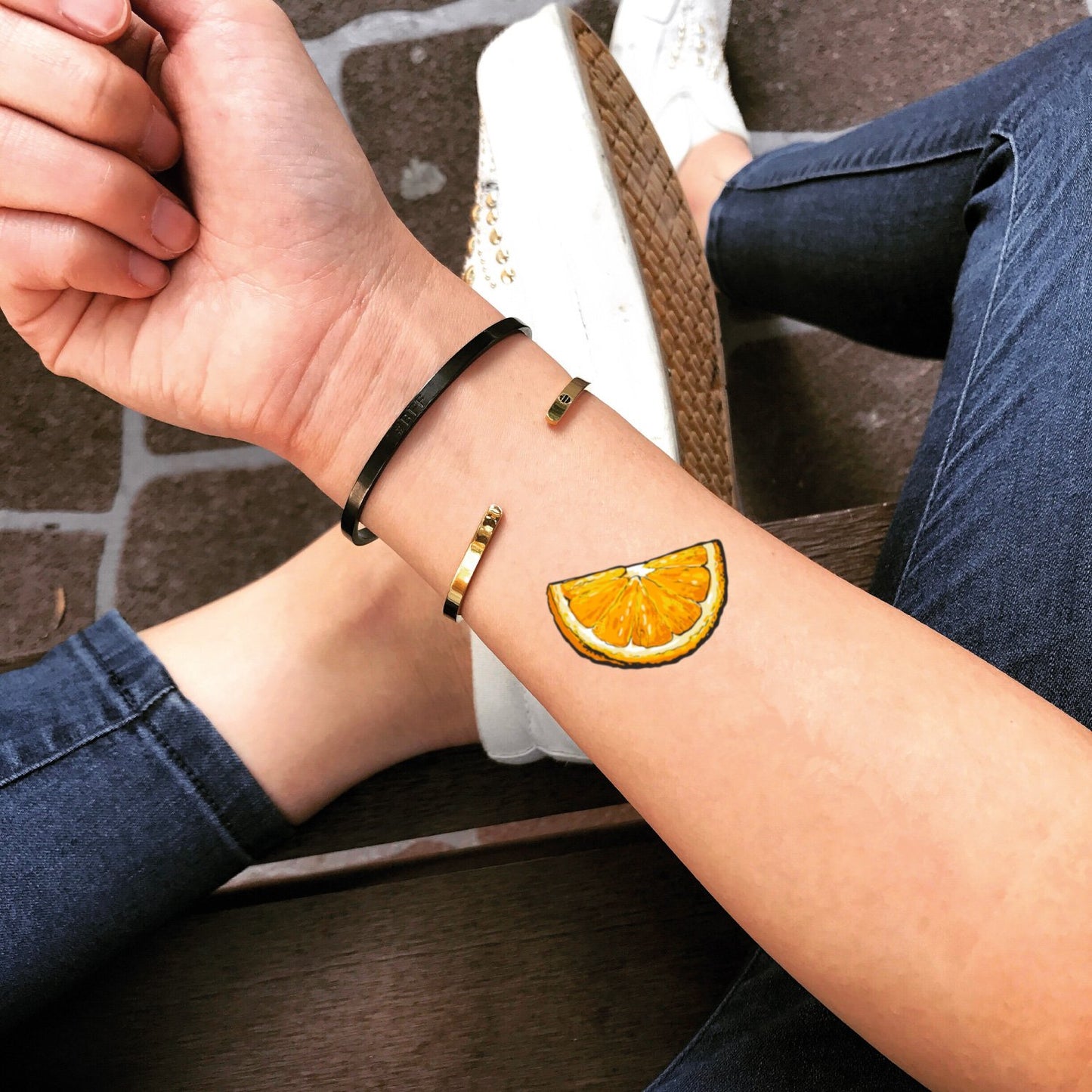 fake small orange food fruit color temporary tattoo sticker design idea on wrist