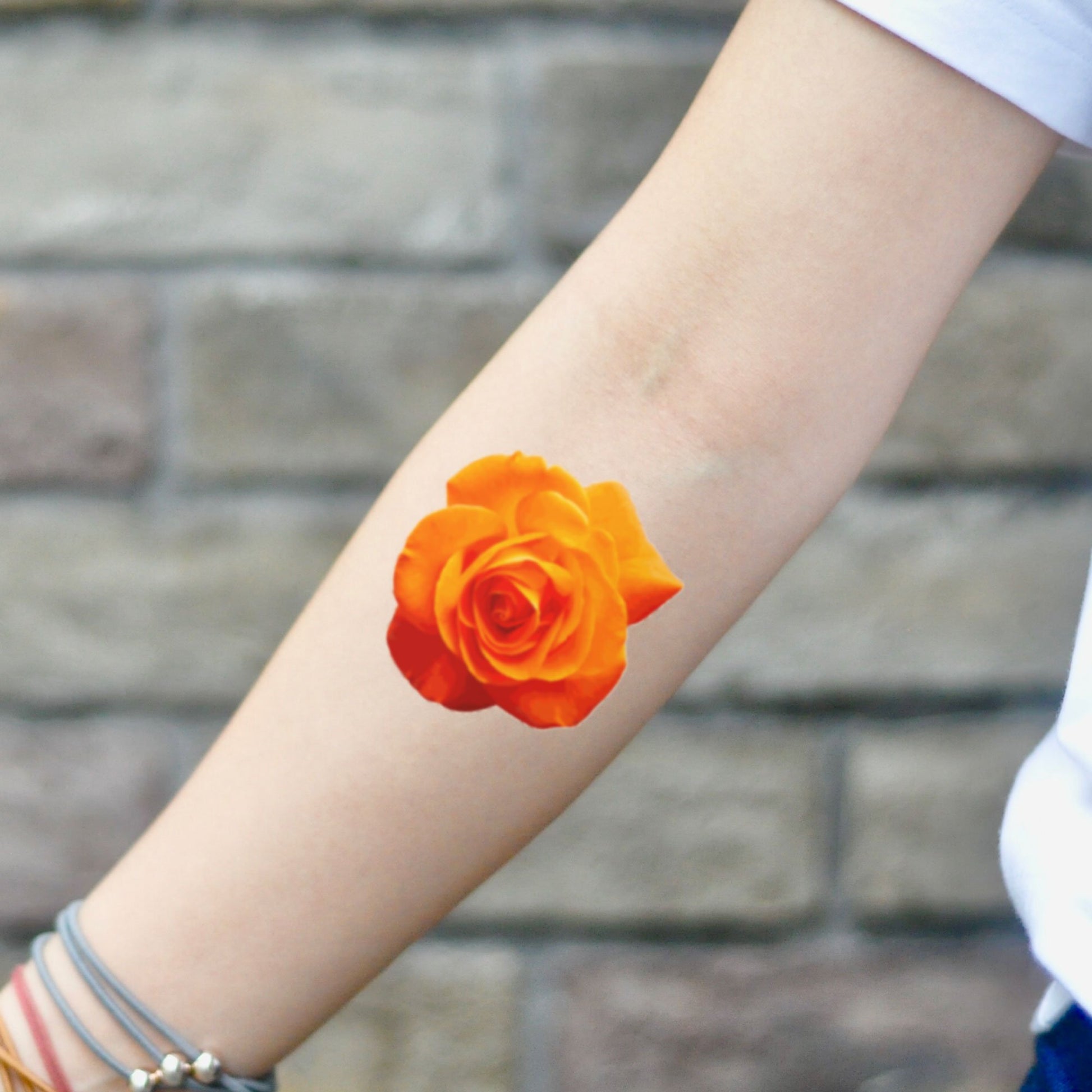 fake small orange rose realistic flower temporary tattoo sticker design idea on inner arm