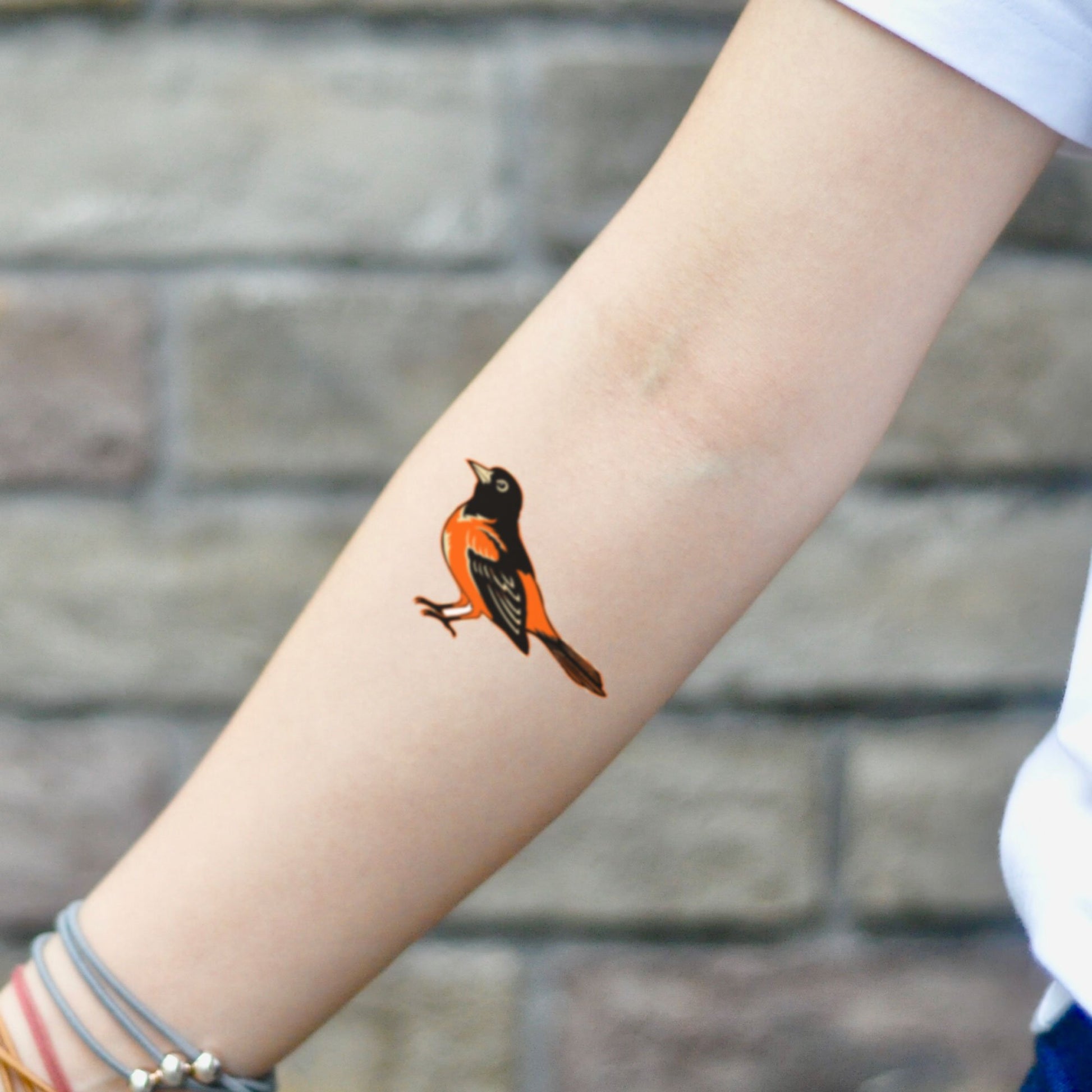 fake small oriole yellow color bird animal temporary tattoo sticker design idea on inner arm