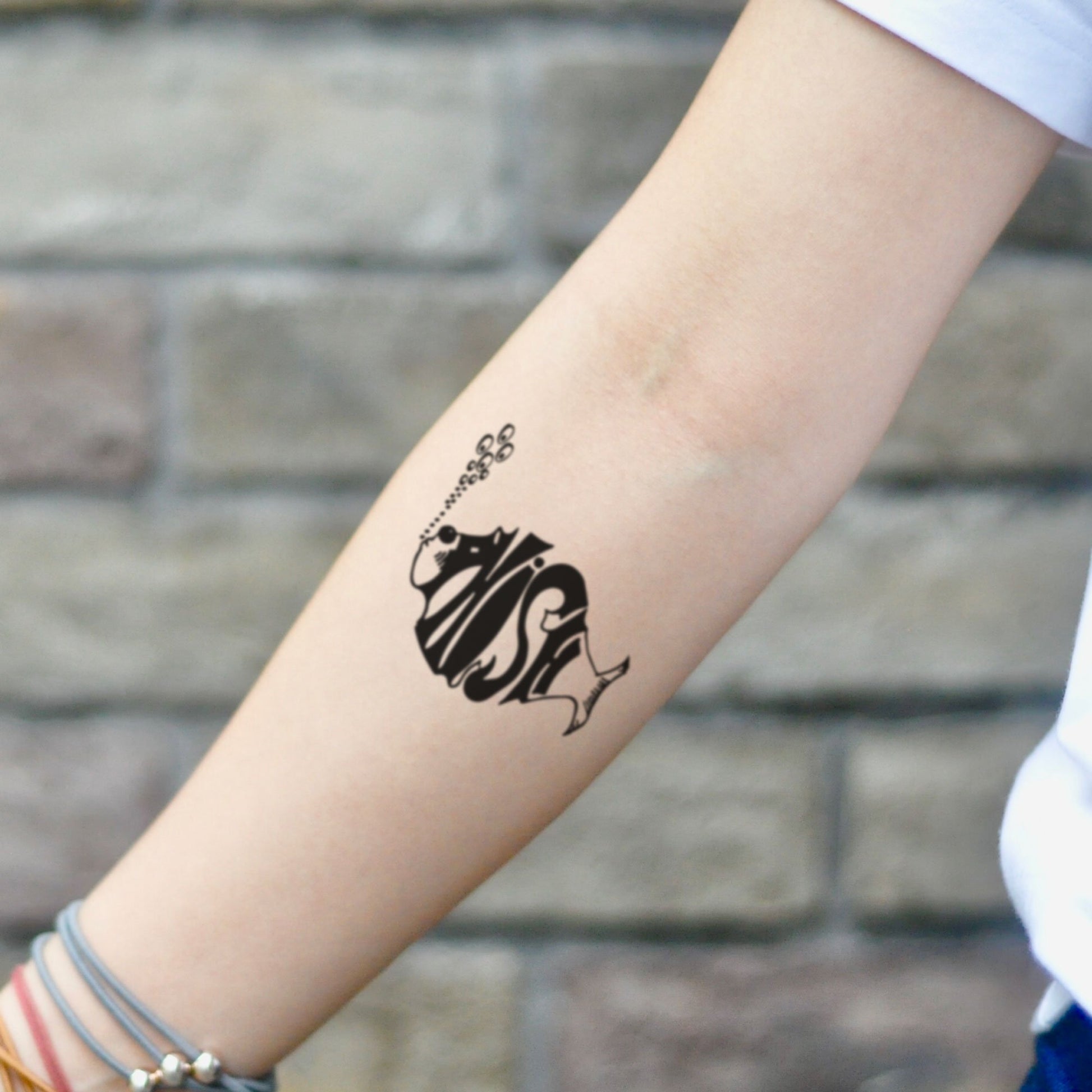 fake small phish lettering temporary tattoo sticker design idea on inner arm