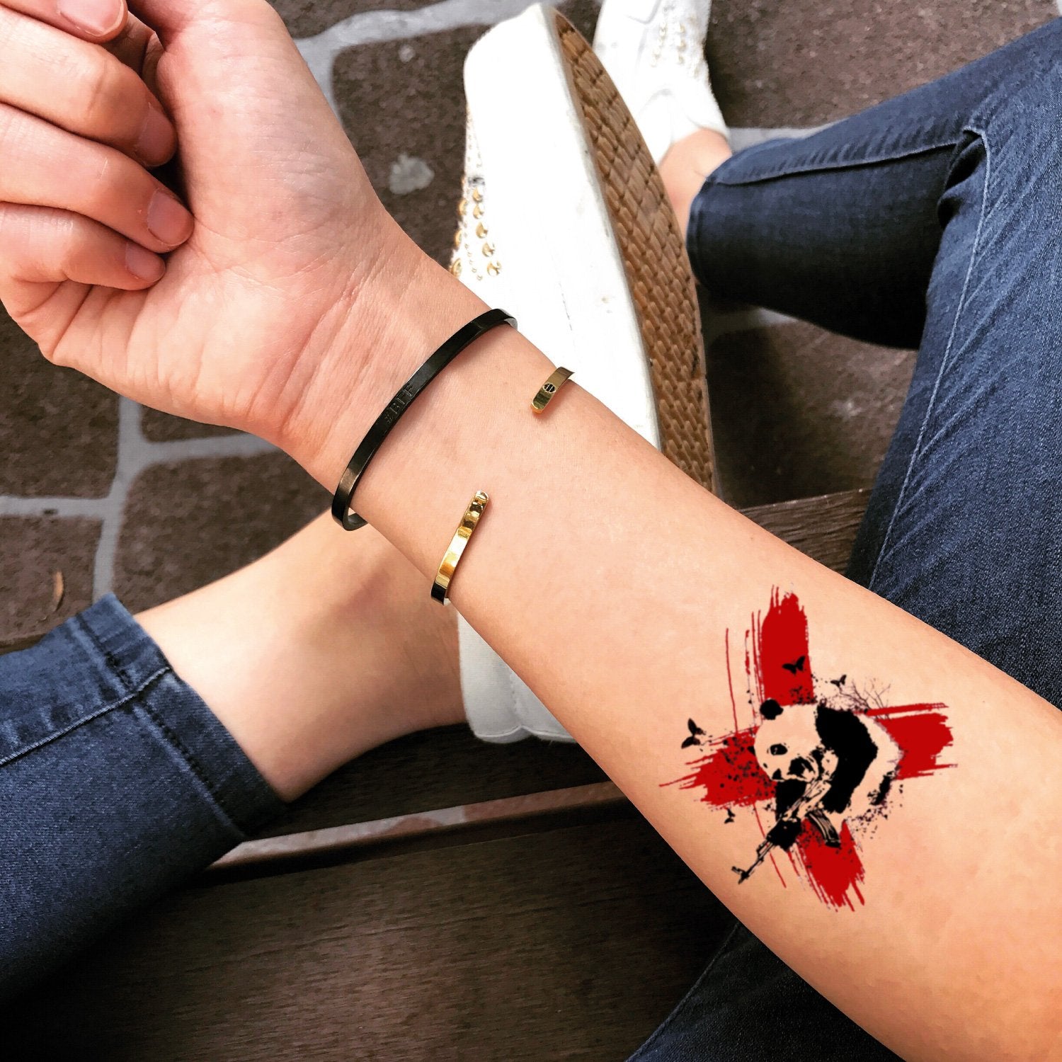 fake small polka dot panda black and red water paint splash animal color temporary tattoo sticker design idea on forearm