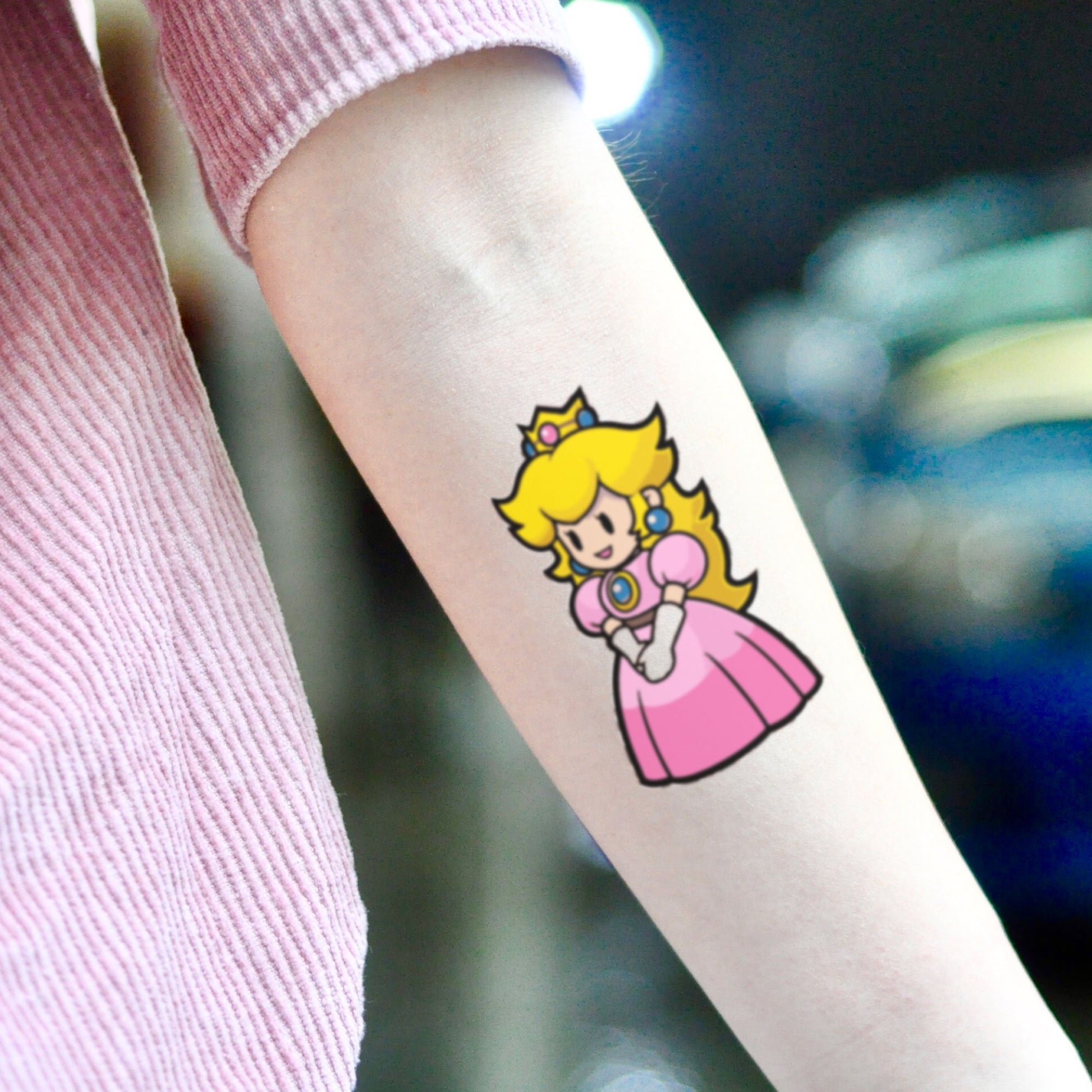 fake small princess peach mario kart cartoon temporary tattoo sticker design idea on inner arm