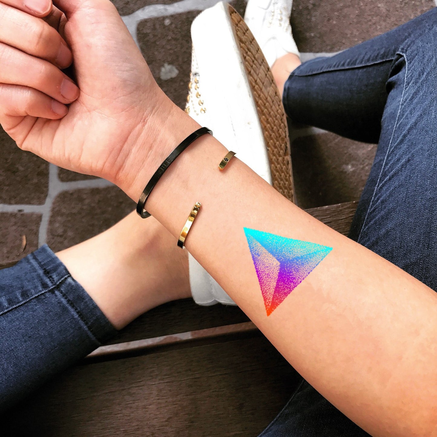 fake small prism rainbow pointillism color theory temporary tattoo sticker design idea on wrist