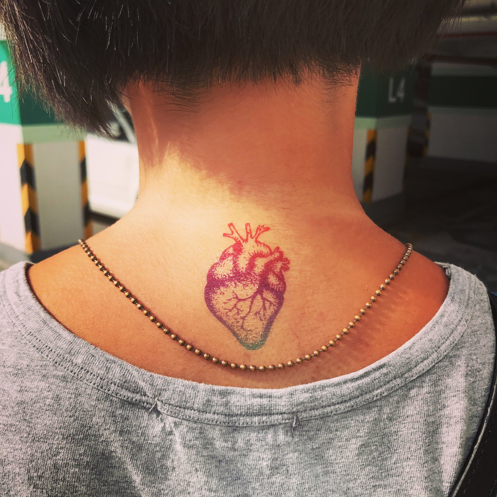 fake small rainbow baby anatomical heart color temporary tattoo sticker design idea on neck