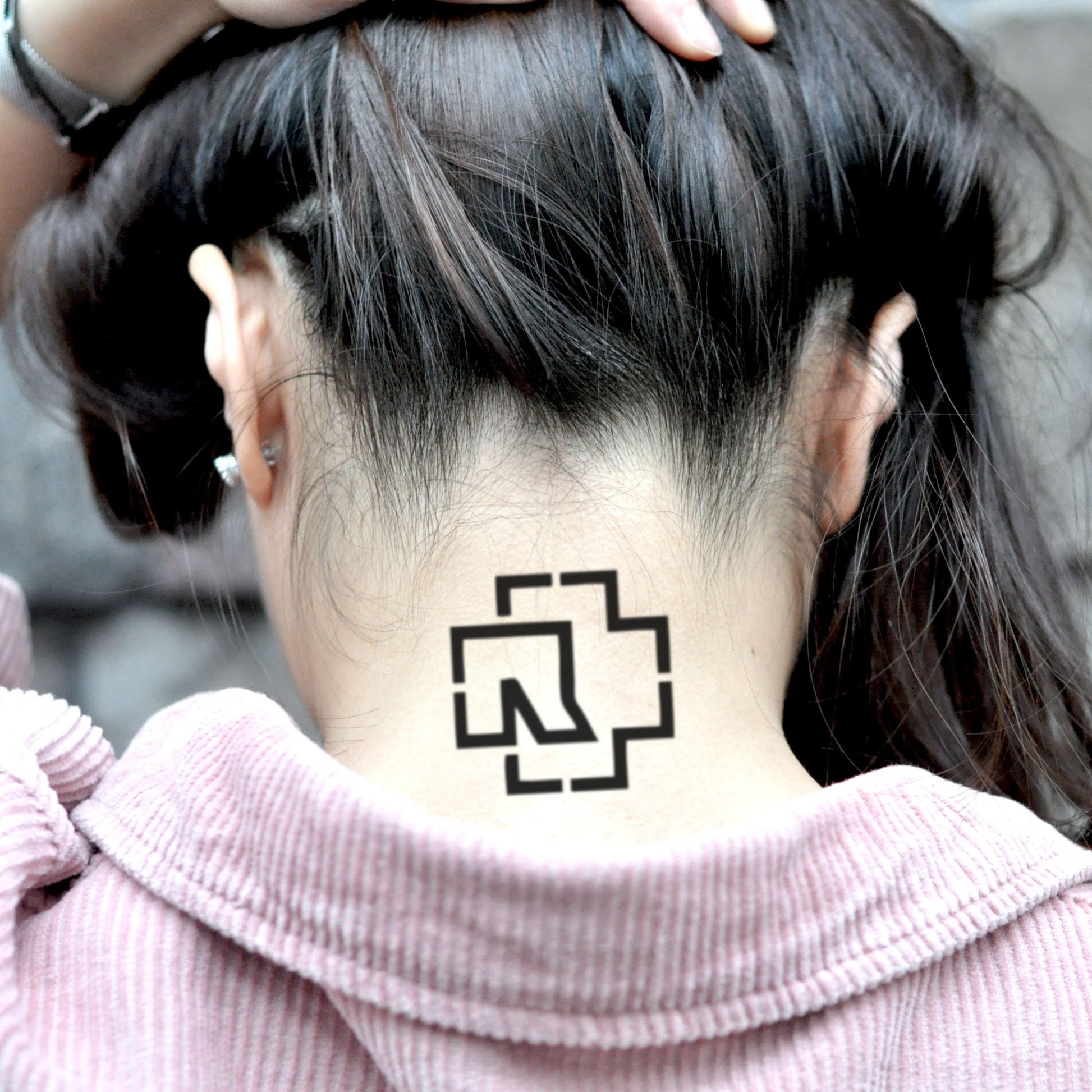 fake small rammstein logo minimalist temporary tattoo sticker design idea on neck
