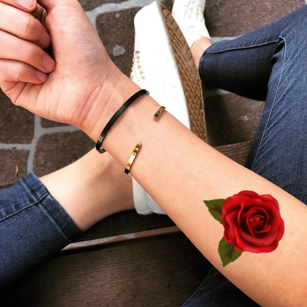fake small red rose petal flower color temporary tattoo sticker design idea on forearm