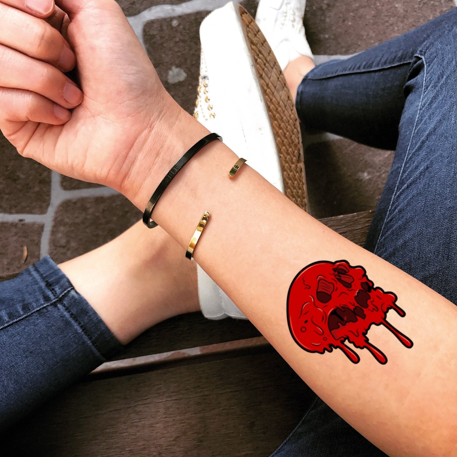 fake small red skull color temporary tattoo sticker design idea on forearm