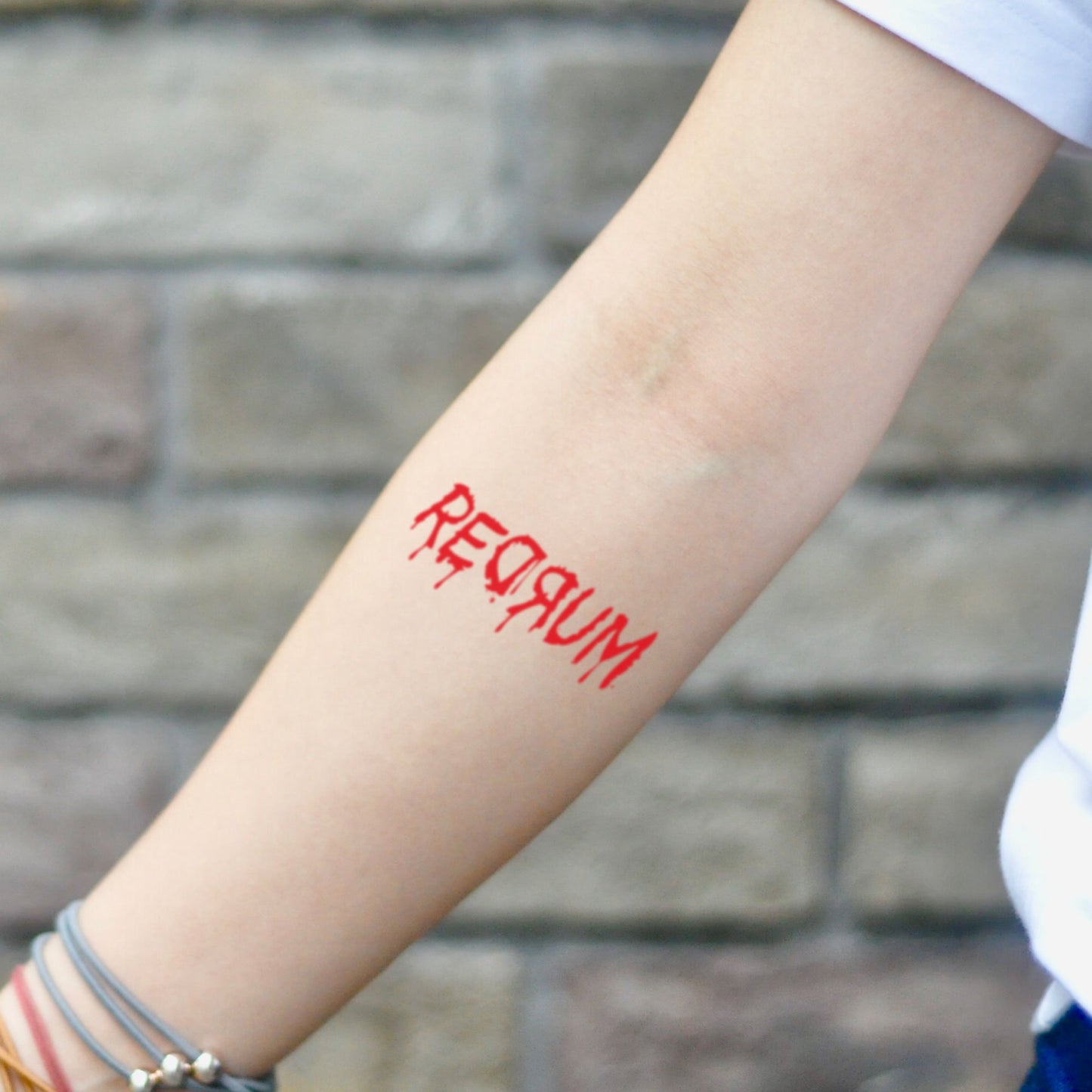 fake small redrum lettering temporary tattoo sticker design idea on inner arm