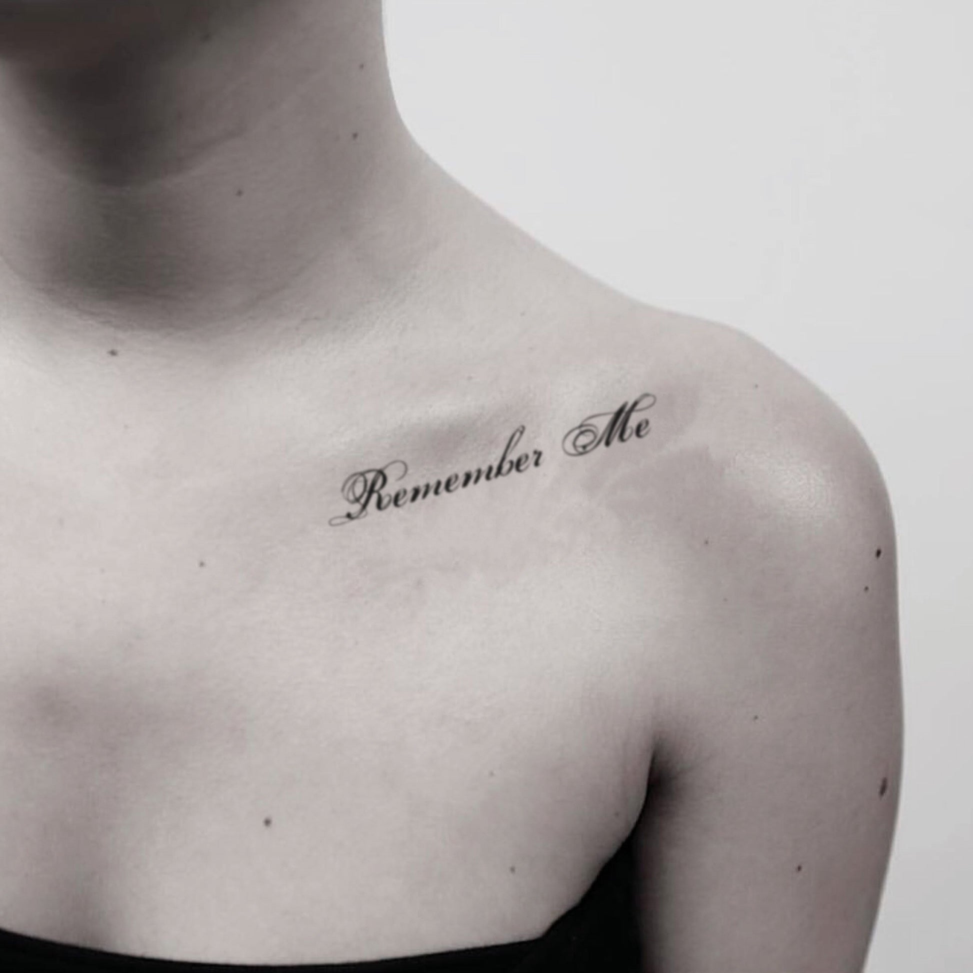 fake small remember me lettering temporary tattoo sticker design idea on shoulder
