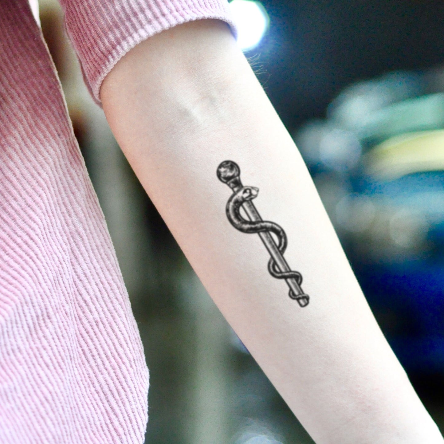 fake small staff rod of asclepius snake nuring medical illustrative temporary tattoo sticker design idea on inner arm