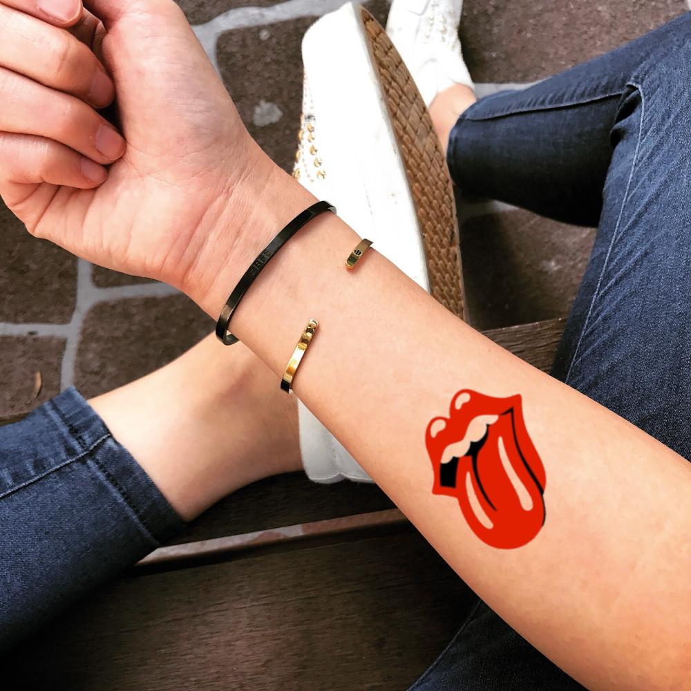 fake small rolling stones tongue color temporary tattoo sticker design idea on inner arm
