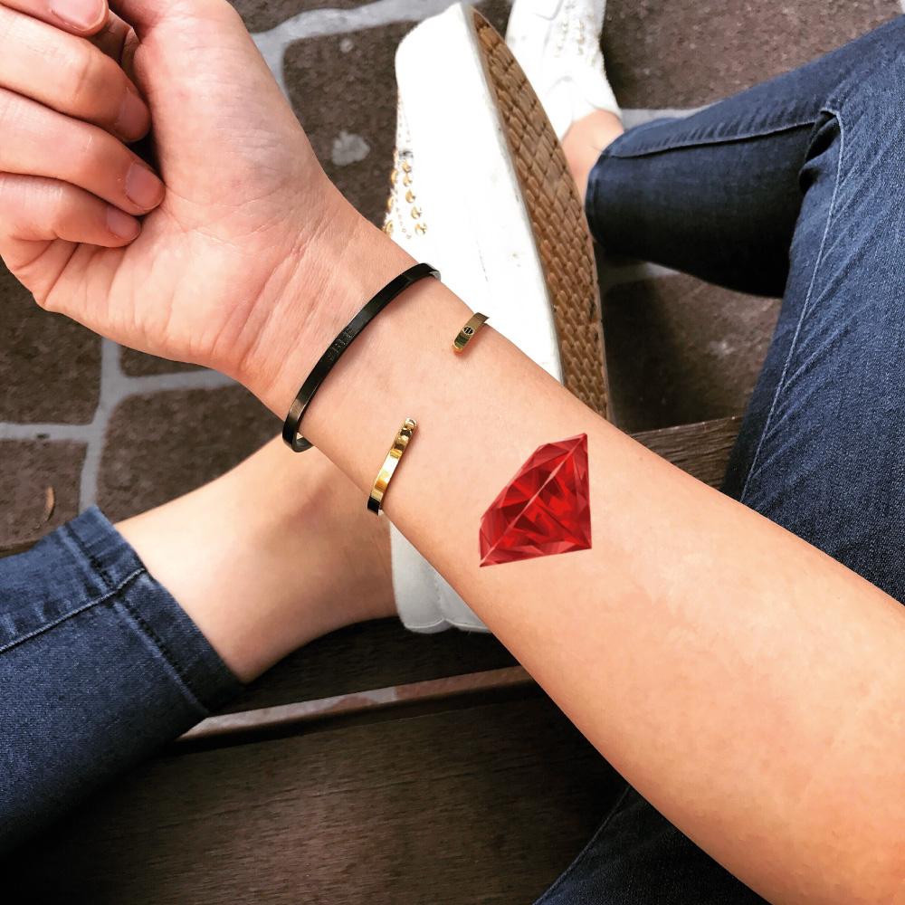 fake small ruby red diamond color jewel temporary tattoo sticker design idea on wrist