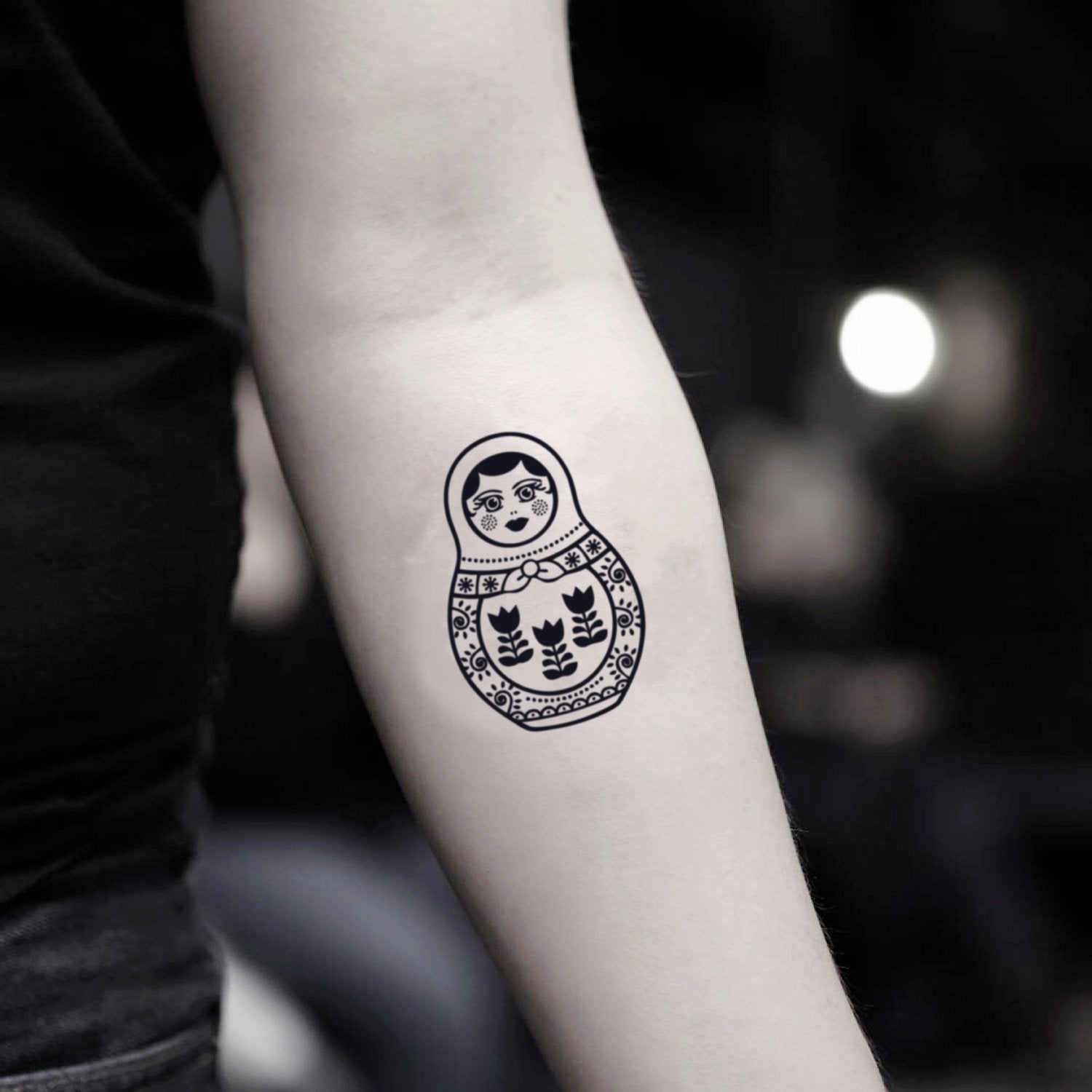 fake small russian matryoshka nesting doll illustrative temporary tattoo sticker design idea on inner arm