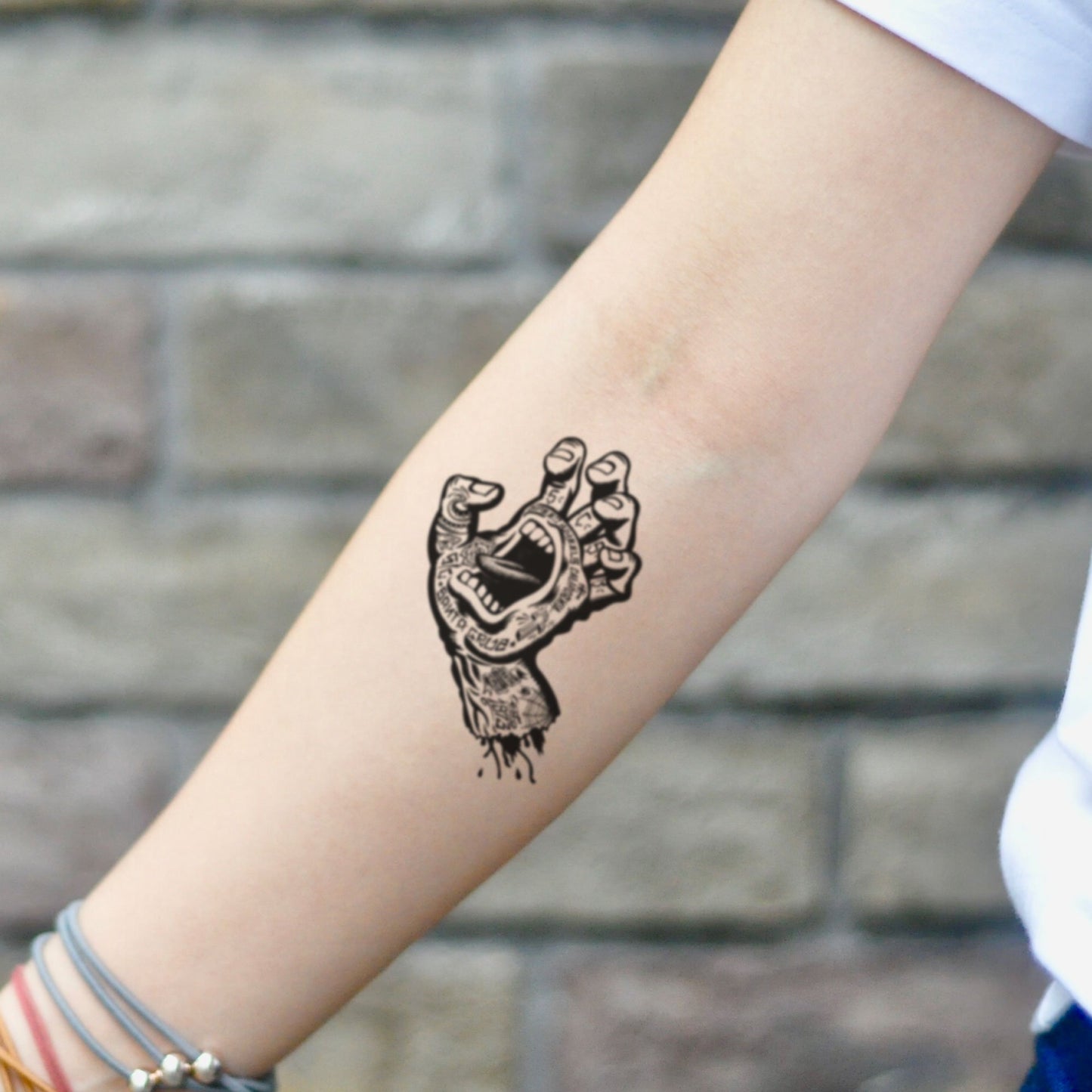 fake small santa cruz screaming zombie hand skateboard logo illustrative temporary tattoo sticker design idea on inner arm