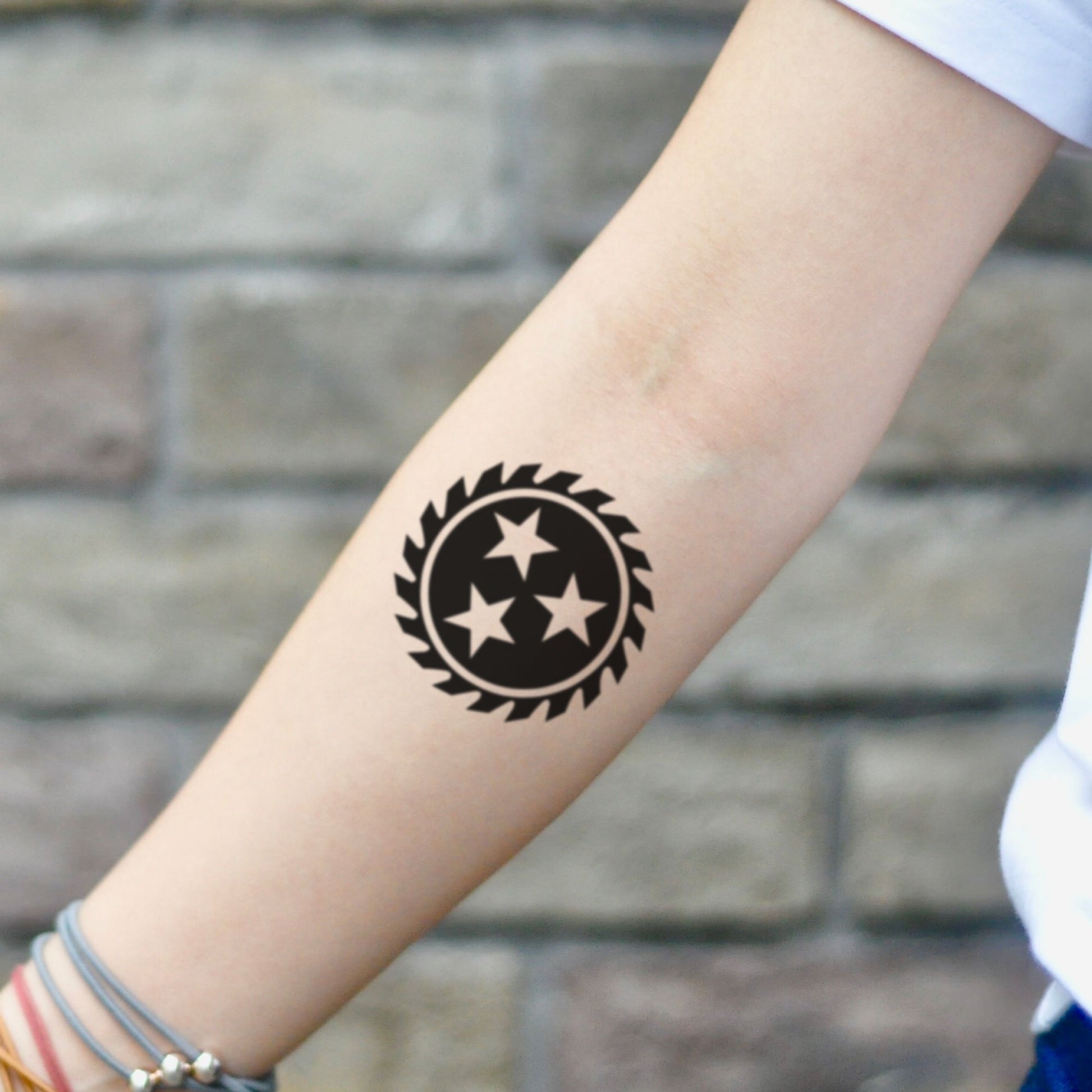 fake small saw blade 3 stars minimalist temporary tattoo sticker design idea on inner arm