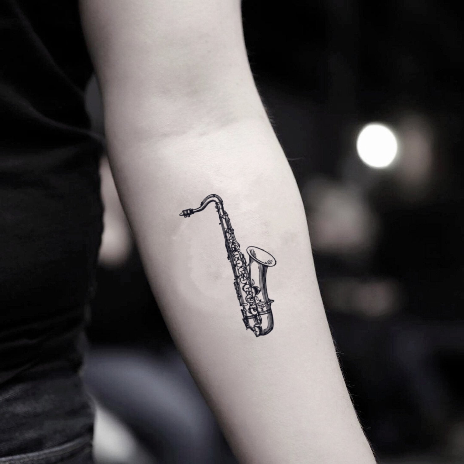 fake small saxophone music temporary tattoo sticker design idea on inner arm