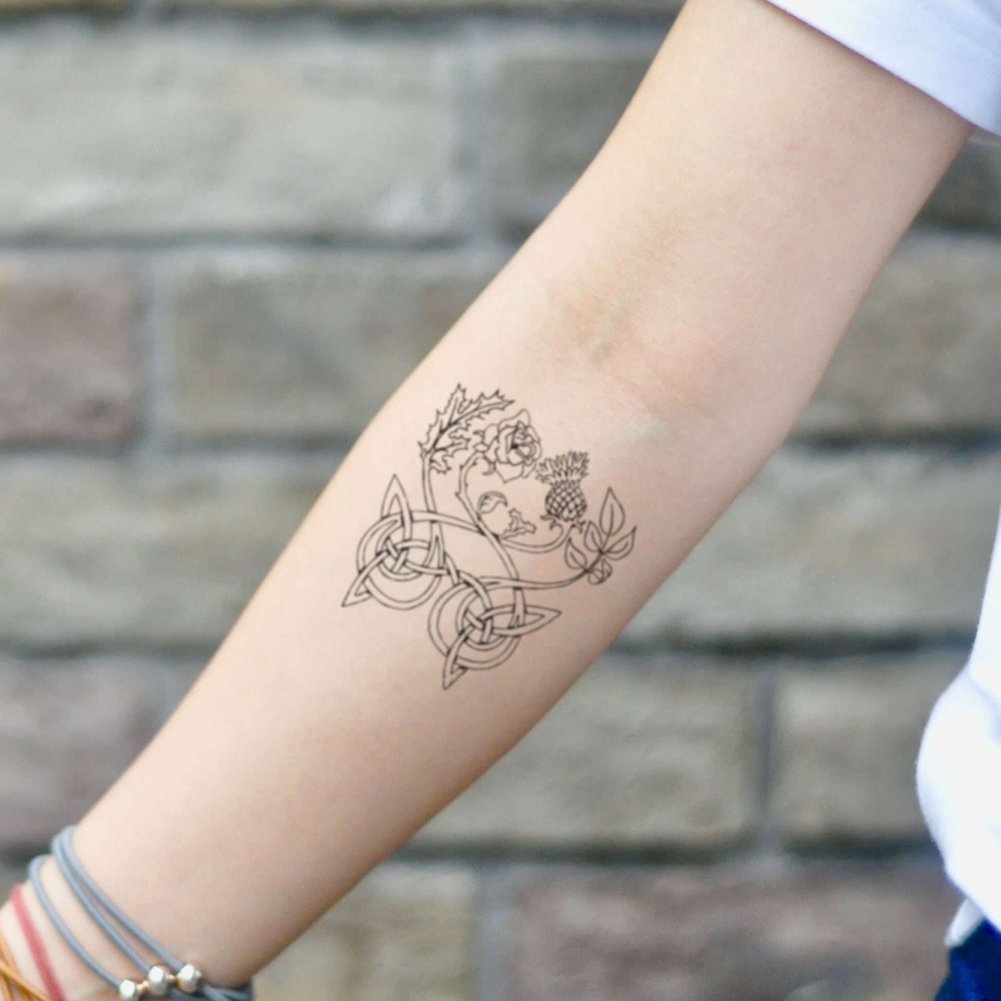 fake small scotch irish thistle england scotland flower temporary tattoo sticker design idea on inner arm
