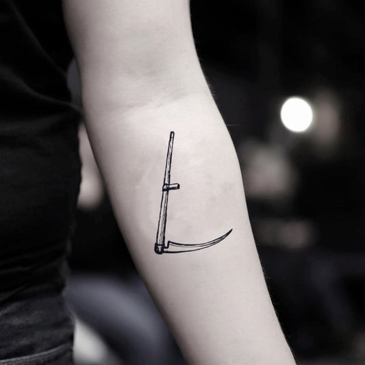 fake small scythe sickle minimalist temporary tattoo sticker design idea on inner arm