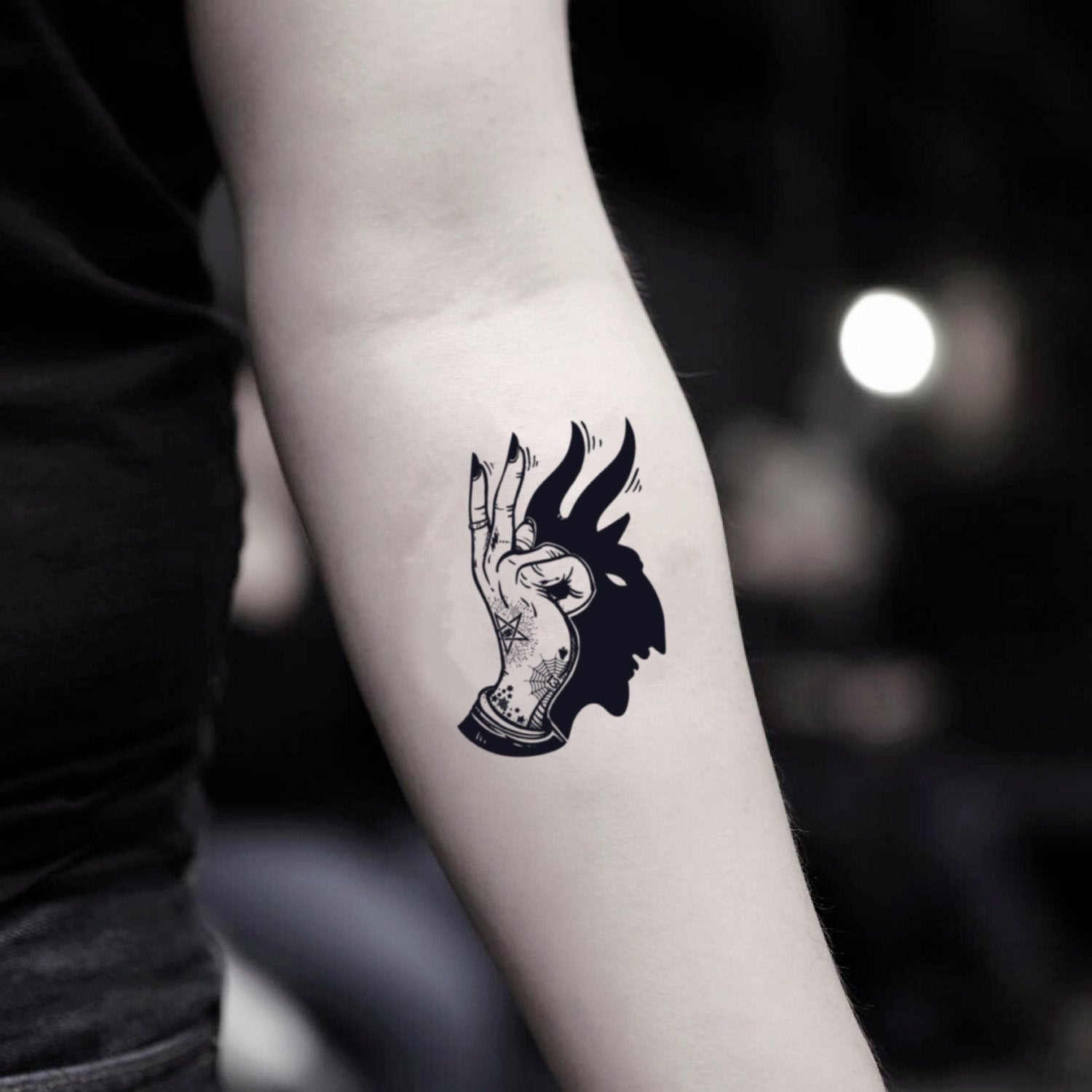 fake small magic hand shadow illustrative temporary tattoo sticker design idea on inner arm