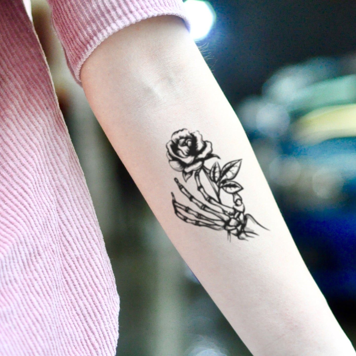 fake small skeleton flower hand holding flower temporary tattoo sticker design idea on inner arm