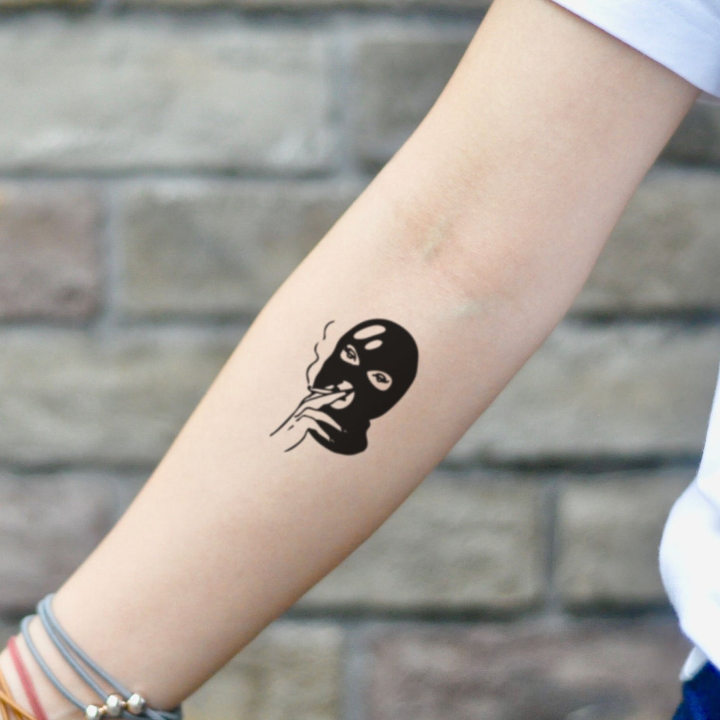 fake small ski mask simple goon gangster smoking minimalist temporary tattoo sticker design idea on inner arm