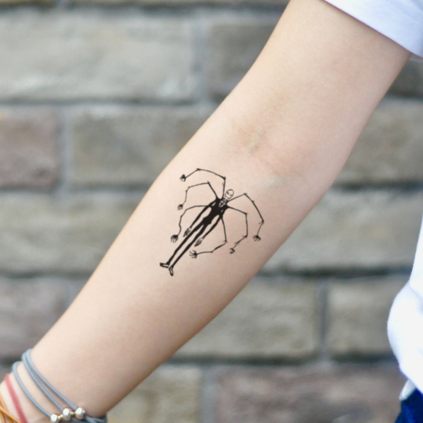 fake small slenderman spooky creepy halloween illustrative temporary tattoo sticker design idea on inner arm