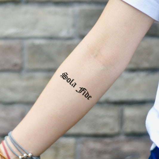 fake small sola fide lain script quote lettering temporary tattoo sticker design idea on inner arm