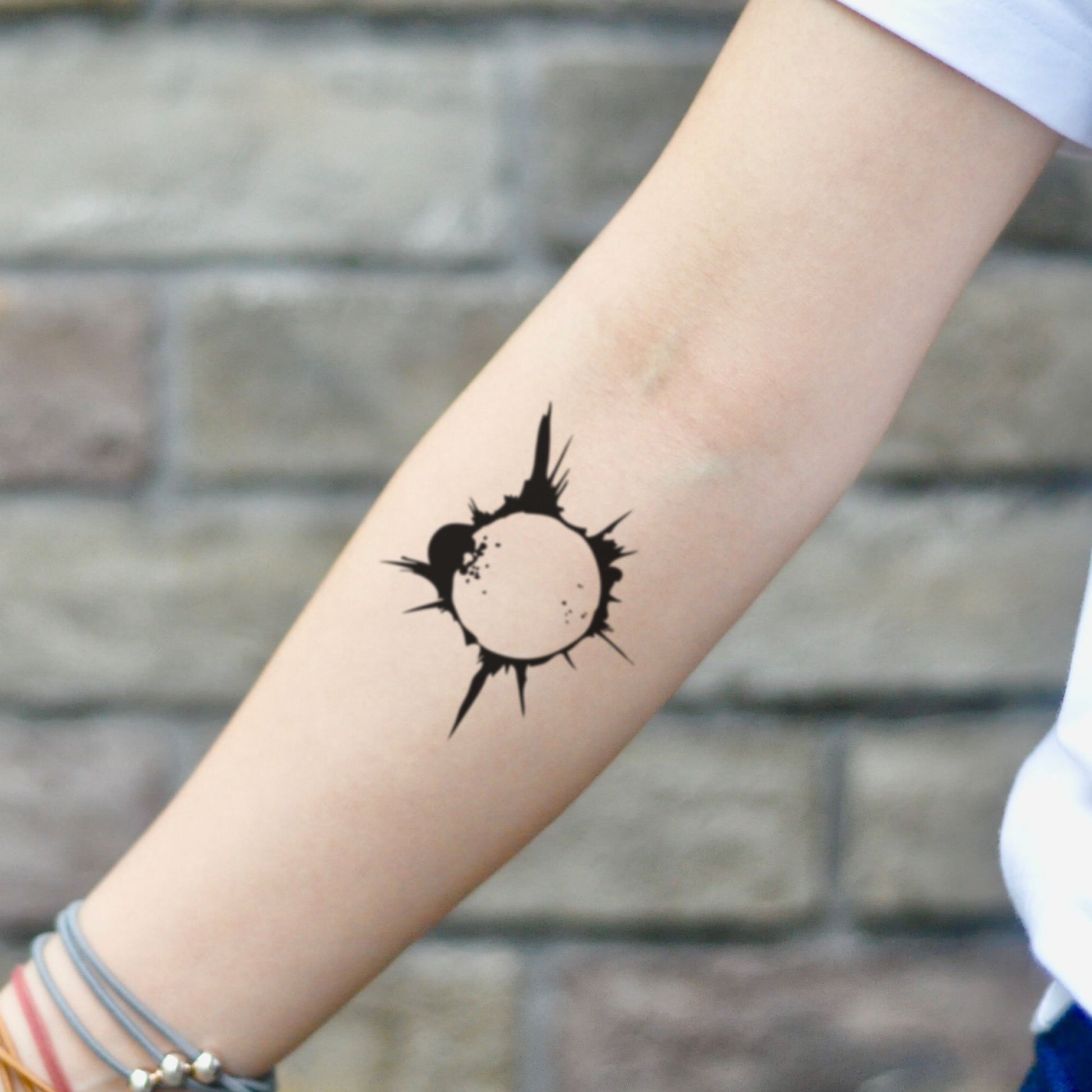 fake small solar eclipse lunar black hole minimalist simple circle geometric temporary tattoo sticker design idea on inner arm