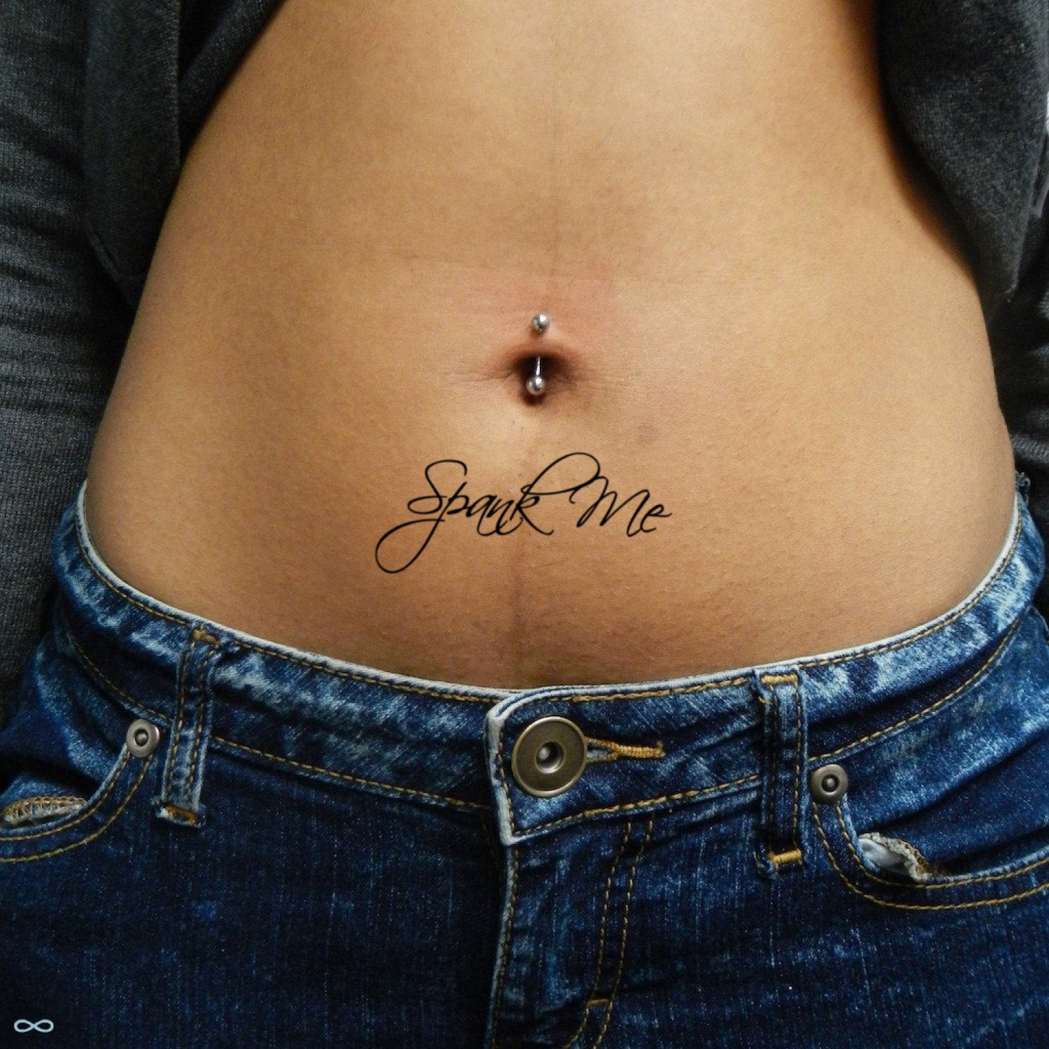 fake small spank me lettering temporary tattoo sticker design idea on stomach