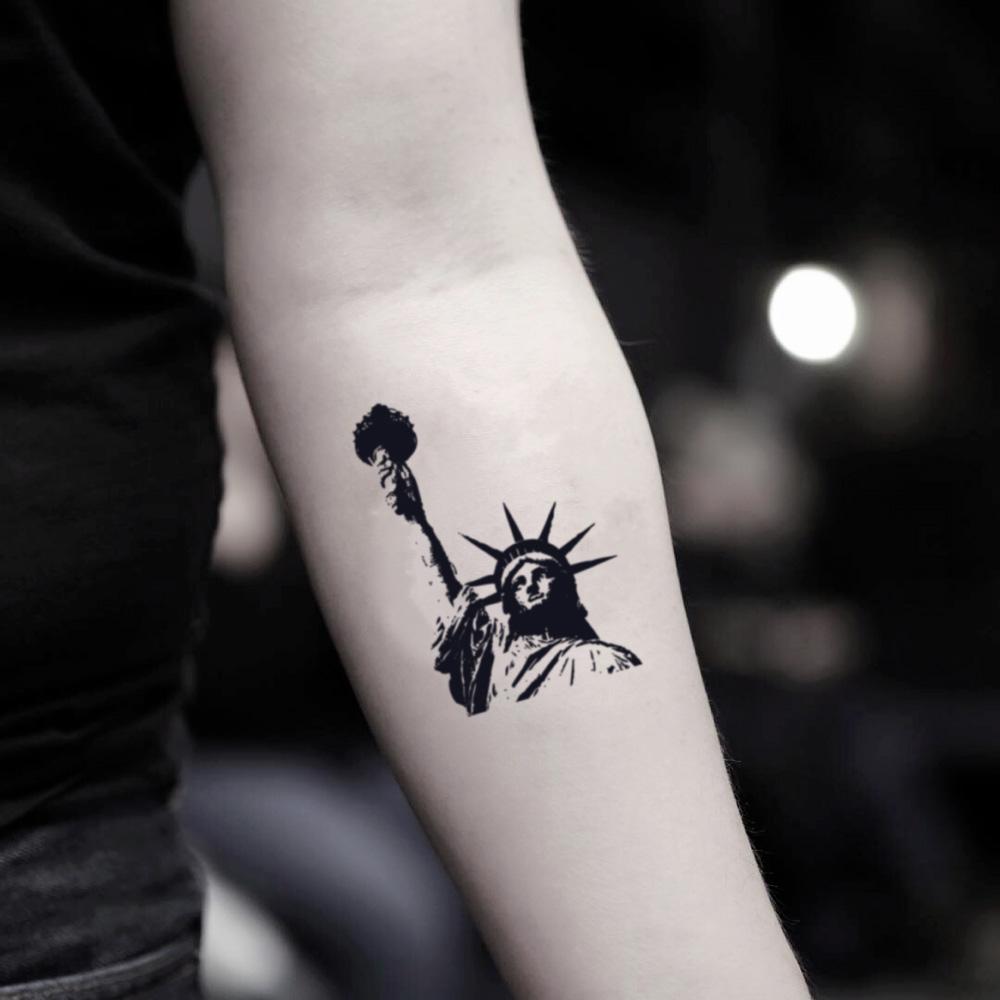 fake small statue of lady liberty best new york city illustrative temporary tattoo sticker design idea on inner arm
