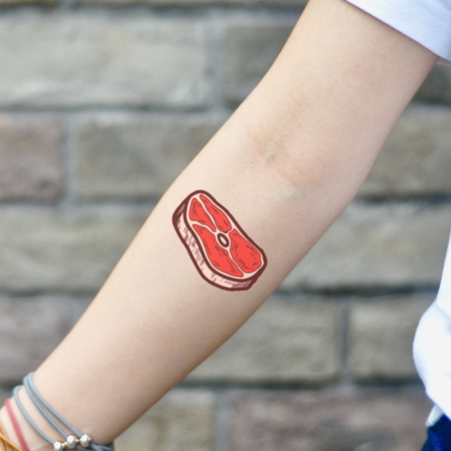 fake small steak beef ribeye food temporary tattoo sticker design idea on inner arm