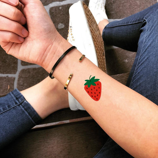 fake small strawberry food color temporary tattoo sticker design idea on wrist