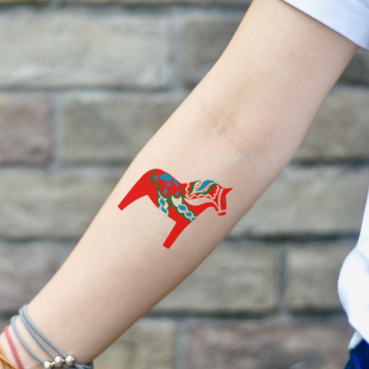 fake small swedish red dala horse folk art color temporary tattoo sticker design idea on inner arm