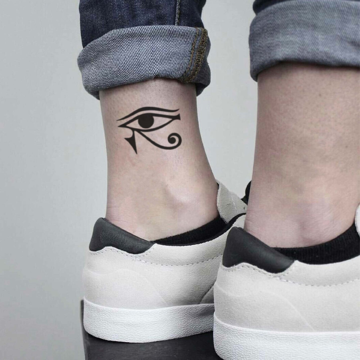 fake small the eye of horus hieroglyphics illustrative temporary tattoo sticker design idea on ankle leg