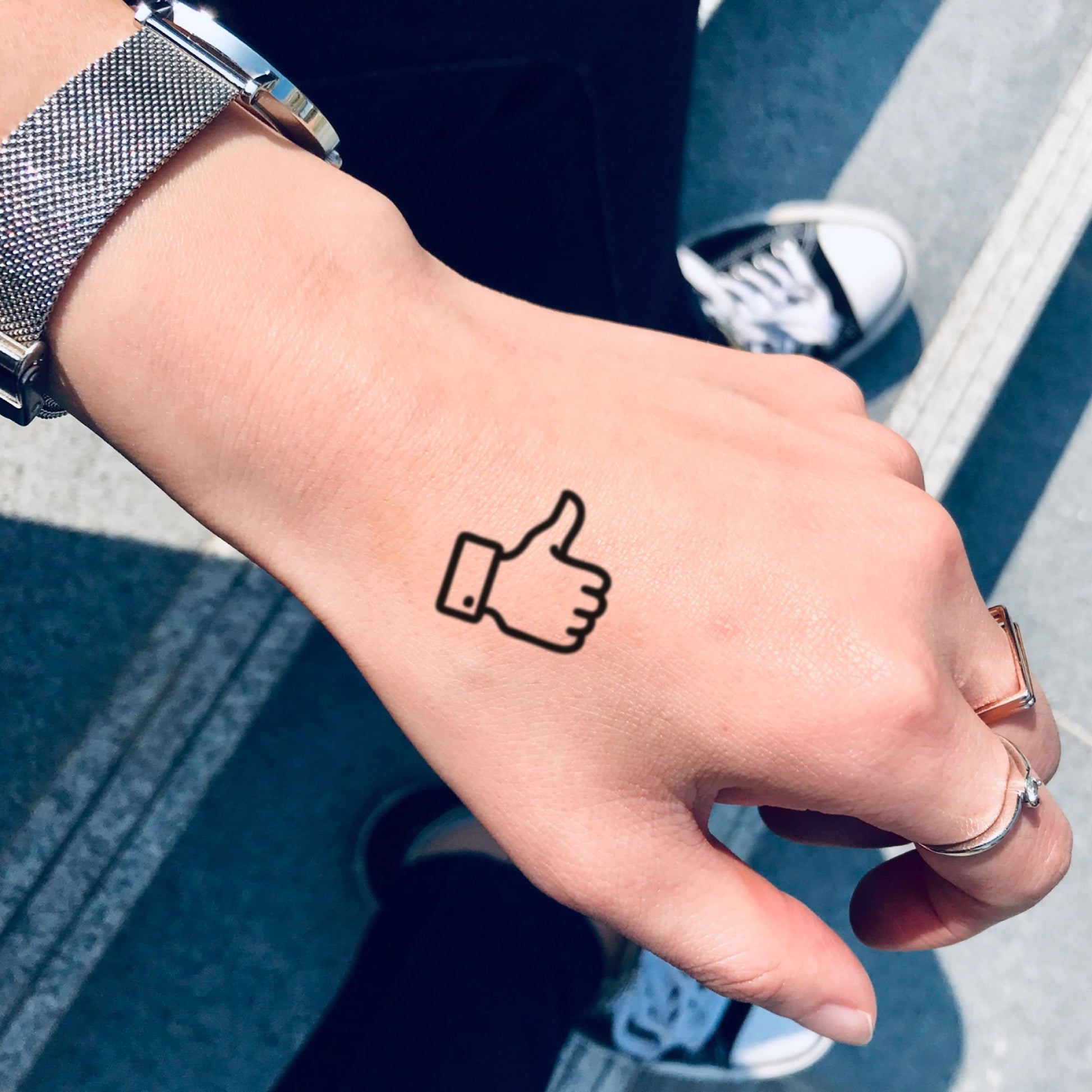 fake small thumbs up minimalist temporary tattoo sticker design idea on hand